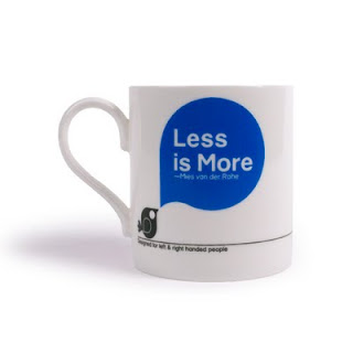 Mug reads "Less is More"